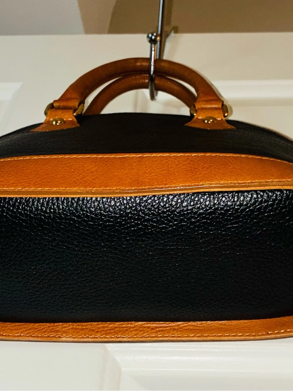 Divina Firenze handbag is crafted from black pebbled leather Made in Italy.